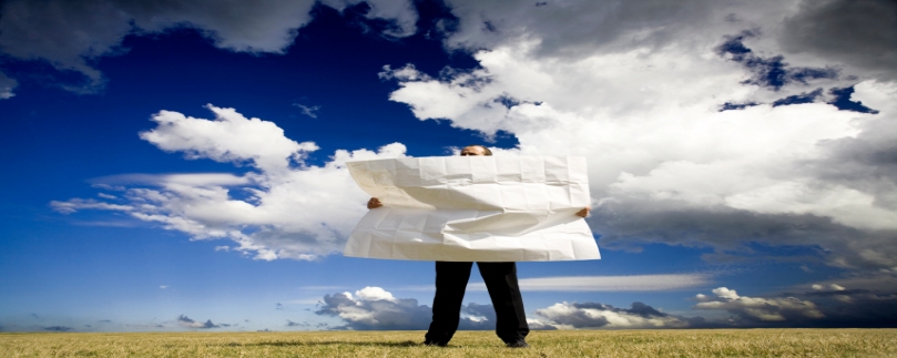 Image of businessman looking at map